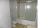 Bathroom showcases a toilet and tub/shower combination with sliding doors for easy access at 3890 Terrazzo Ave, Las Vegas, NV 89115