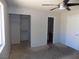View of bedroom featuring closet, bathroom entry, and a window at 3890 Terrazzo Ave, Las Vegas, NV 89115