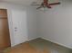 View of bedroom featuring ceiling fan and door leading outside at 3890 Terrazzo Ave, Las Vegas, NV 89115