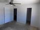 View of bedroom featuring ceiling fan and door leading to bathroom and closet at 3890 Terrazzo Ave, Las Vegas, NV 89115