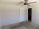 View of bedroom featuring ceiling fan and door leading to bathroom at 3890 Terrazzo Ave, Las Vegas, NV 89115