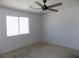 Bedroom features a window, ceiling fan, and outlets, providing comfort and convenience at 3890 Terrazzo Ave, Las Vegas, NV 89115