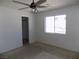 Bright bedroom features a ceiling fan, closet, and a window for natural light at 3890 Terrazzo Ave, Las Vegas, NV 89115