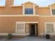 Charming townhome with stucco exterior, decorative windows, and inviting front entrance at 3890 Terrazzo Ave, Las Vegas, NV 89115