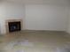 Spacious living room featuring a cozy fireplace and tile flooring, perfect for relaxation at 3890 Terrazzo Ave, Las Vegas, NV 89115