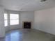 Bright living area featuring a fireplace, large windows, and ample space for entertainment at 3890 Terrazzo Ave, Las Vegas, NV 89115