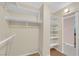 Walk-in closet with built-in shelving and lighting at 3930 University Center Dr # 202, Las Vegas, NV 89119