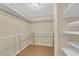 Walk-in closet with wire shelving and wood floors at 3930 University Center Dr # 202, Las Vegas, NV 89119
