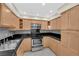Traditional kitchen featuring stainless steel appliances, tile floors, and ample cabinet space at 3930 University Center Dr # 202, Las Vegas, NV 89119