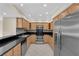 Modern kitchen with stainless steel appliances, granite counters, and ample cabinetry at 3930 University Center Dr # 202, Las Vegas, NV 89119