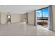 Open living space with tile flooring, ample sunlight and view of the city at 3930 University Center Dr # 202, Las Vegas, NV 89119