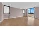 Living room featuring wood floors, natural light, and minimal decor at 3930 University Center Dr # 202, Las Vegas, NV 89119