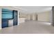 Expansive living room boasting tile flooring and a bar area for entertaining at 3930 University Center Dr # 202, Las Vegas, NV 89119