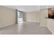 Bright living room with tile flooring adjacent to eat in kitchen bar area at 3930 University Center Dr # 202, Las Vegas, NV 89119