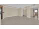 Spacious living area showcasing tile floors, neutral decor, and ample natural light at 3930 University Center Dr # 202, Las Vegas, NV 89119