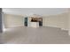 Open-concept living room with tile floors and an adjoining kitchen area at 3930 University Center Dr # 202, Las Vegas, NV 89119