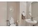Well-lit half bathroom featuring modern fixtures, a vessel sink, and neutral decor at 4135 Pistachio Nut Ave, Las Vegas, NV 89115