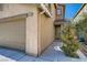 Charming home featuring a two-car garage and a cozy entrance surrounded by well-maintained desert landscaping at 4135 Pistachio Nut Ave, Las Vegas, NV 89115