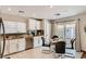 Modern eat-in kitchen with stainless steel appliances, granite countertops, and a seamless transition to outdoor access at 4135 Pistachio Nut Ave, Las Vegas, NV 89115