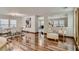 Spacious living room with hardwood floors, neutral furniture, and abundant natural light flowing into the space at 4135 Pistachio Nut Ave, Las Vegas, NV 89115