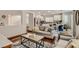 Inviting living room showcases stylish furniture, hardwood floors, and seamless flow to the modern kitchen at 4135 Pistachio Nut Ave, Las Vegas, NV 89115