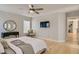 Bright main bedroom featuring a ceiling fan, wood floors, and ample natural light at 4135 Pistachio Nut Ave, Las Vegas, NV 89115