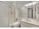 Clean bathroom with walk-in shower, large mirror, toilet, and sink with white cabinetry at 4237 Brockton Green Ct, Las Vegas, NV 89110