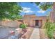 Charming single-story home with stucco exterior, desert landscaping and inviting front entryway at 4237 Brockton Green Ct, Las Vegas, NV 89110