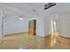 Bright living room with hardwood floors, a wooden hutch, and access to a hallway and doorway at 4237 Brockton Green Ct, Las Vegas, NV 89110