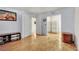 Open-concept living room with hardwood floors, neutral walls, and ample space for furnishings at 4237 Brockton Green Ct, Las Vegas, NV 89110