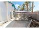 Private patio featuring a gazebo, concrete flooring, brick walls, and bordered landscaping creating an inviting outdoor space at 5025 Starfinder Ave, Las Vegas, NV 89108