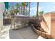 Enclosed patio featuring a gazebo, concrete flooring, brick walls, and bordered landscaping, creating an inviting outdoor space at 5025 Starfinder Ave, Las Vegas, NV 89108
