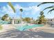 Community pool surrounded by palms and a bright blue fence, providing a refreshing oasis for residents at 5025 Starfinder Ave, Las Vegas, NV 89108