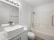 Bright bathroom featuring a shower-over-tub and vanity with a contemporary above-counter sink at 5241 Caspian Springs Dr # 103, Las Vegas, NV 89120