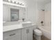 Bathroom features modern fixtures, a white vanity and shower over tub at 5241 Caspian Springs Dr # 103, Las Vegas, NV 89120