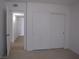 Bedroom with sliding closet doors and hall access showcases modern design at 5241 Caspian Springs Dr # 103, Las Vegas, NV 89120