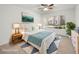 Staged bedroom with a ceiling fan, a picture window and neutral decor at 5241 Caspian Springs Dr # 103, Las Vegas, NV 89120