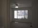 This bedroom has a ceiling fan and a bright window view at 5241 Caspian Springs Dr # 103, Las Vegas, NV 89120