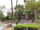A well landscaped building featuring mature palm trees and desert landscaping at 5241 Caspian Springs Dr # 103, Las Vegas, NV 89120