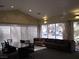 A spacious clubhouse lounge offers comfortable seating, a large table, and scenic window views at 5241 Caspian Springs Dr # 103, Las Vegas, NV 89120