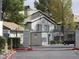 Gated community entrance with desert landscaping and signage at 5241 Caspian Springs Dr # 103, Las Vegas, NV 89120
