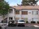 Inviting condo features a red tile roof, two stories, ample parking, and a stucco facade at 5241 Caspian Springs Dr # 103, Las Vegas, NV 89120