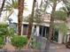 Community building set amid lush landscaping and mature trees at 5241 Caspian Springs Dr # 103, Las Vegas, NV 89120