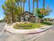 Community recreation center is nestled between palms and shrubs with manicured lawns at 5241 Caspian Springs Dr # 103, Las Vegas, NV 89120