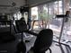Fitness center offering treadmills, stationary bikes, and weight machines, overlooking the pool at 5241 Caspian Springs Dr # 103, Las Vegas, NV 89120