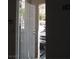 Open front door to a condo unit with security screen door and views of the parking lot at 5241 Caspian Springs Dr # 103, Las Vegas, NV 89120