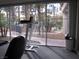 Well-equipped gym with views of the pool and surrounding landscape at 5241 Caspian Springs Dr # 103, Las Vegas, NV 89120