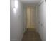 Hallway features tile flooring and white doors, creating a clean and modern aesthetic at 5241 Caspian Springs Dr # 103, Las Vegas, NV 89120