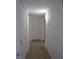 Hallway with tile flooring, white doors, and modern lighting fixtures at 5241 Caspian Springs Dr # 103, Las Vegas, NV 89120