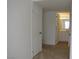 Hallway leads to a bright bathroom with a vanity and mirror at 5241 Caspian Springs Dr # 103, Las Vegas, NV 89120